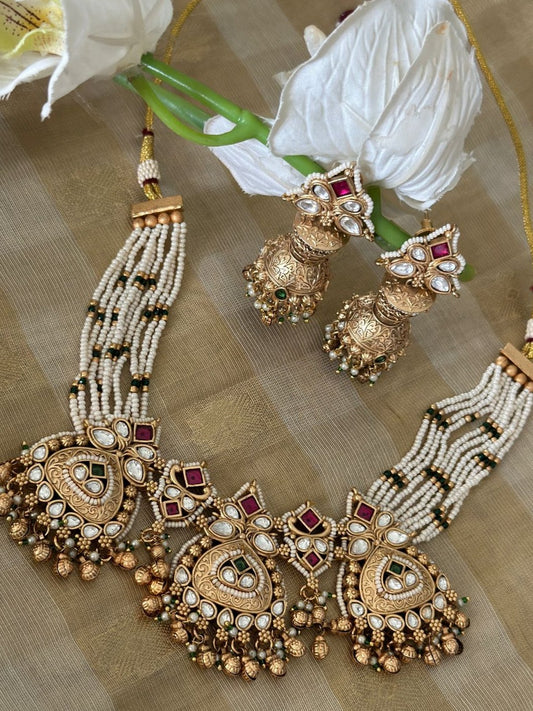 Traditional gold kundan polki set with jhumkis