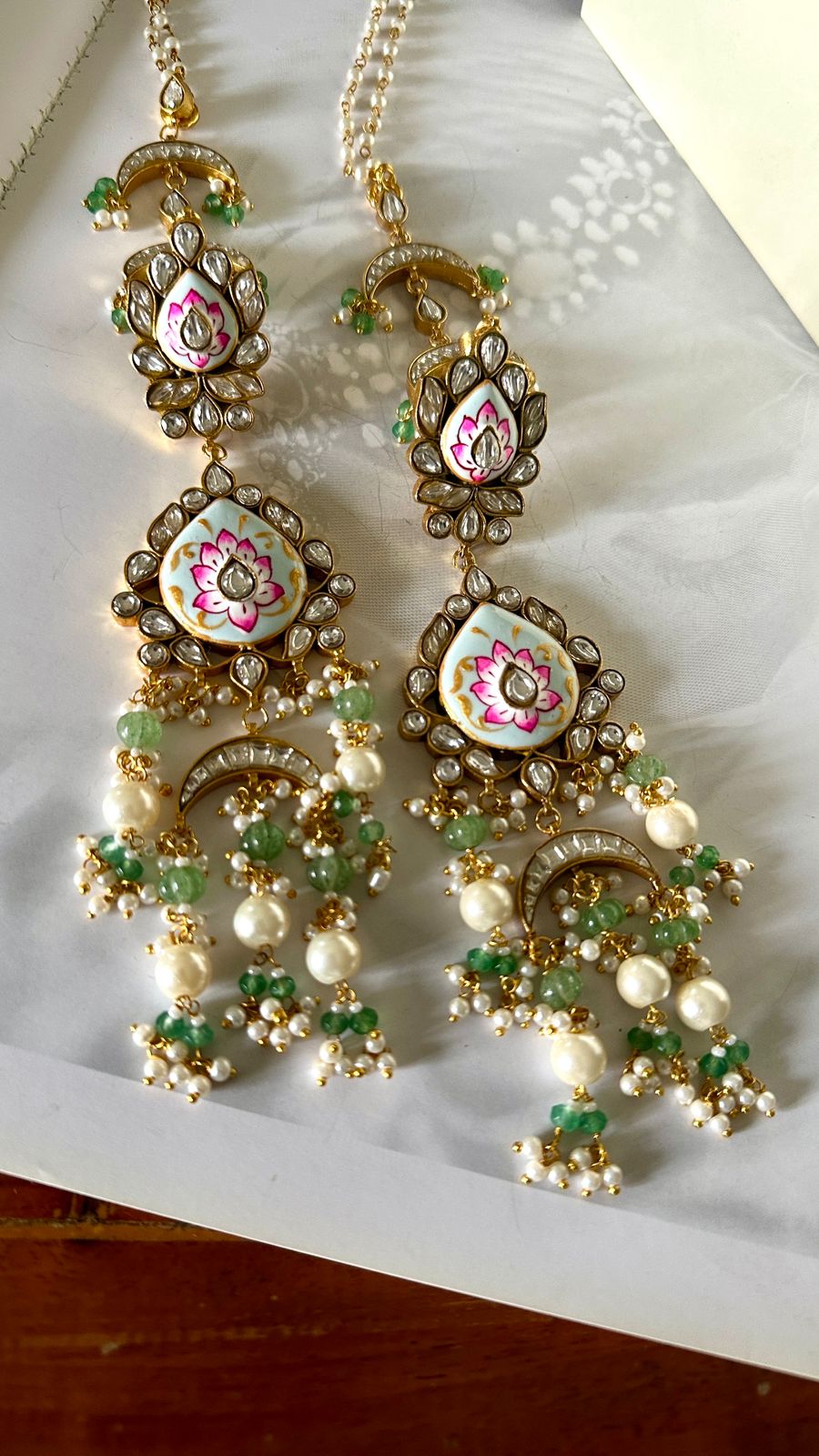 Meenakari kundan long earrings.