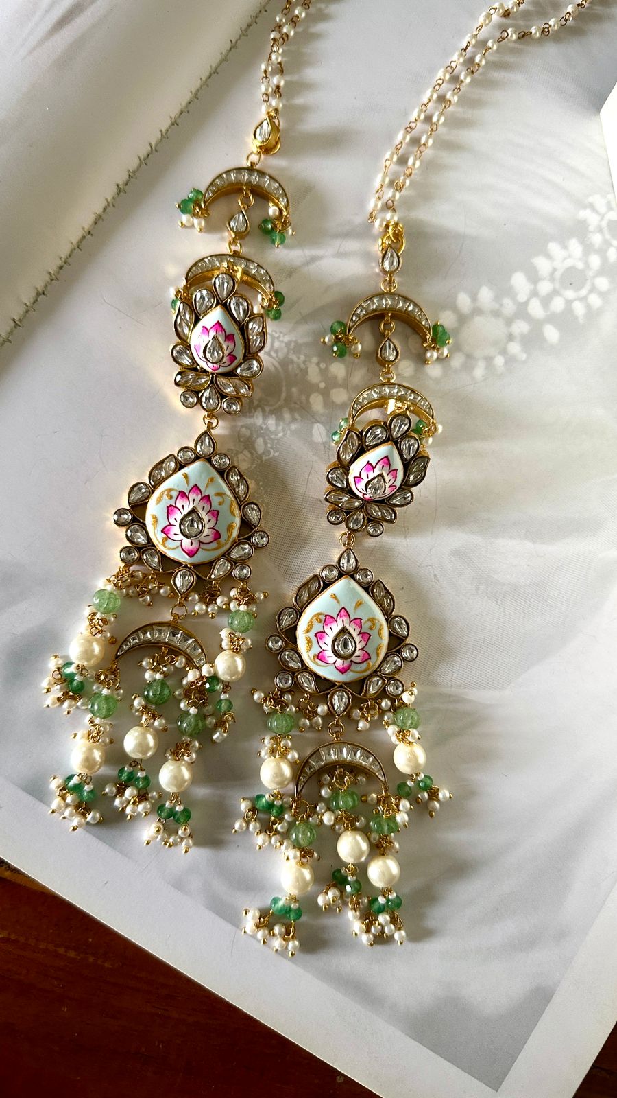 Meenakari kundan long earrings.