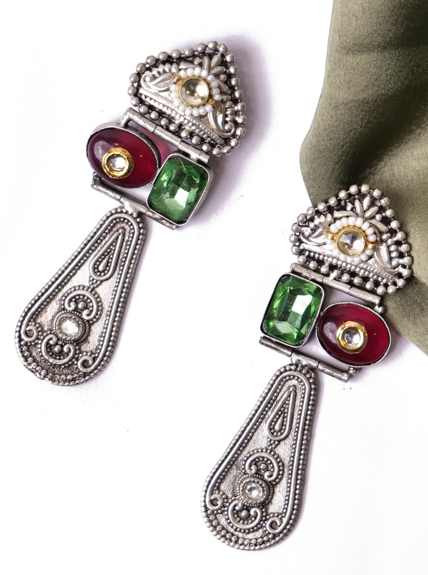 Silver beauties in red and green stones