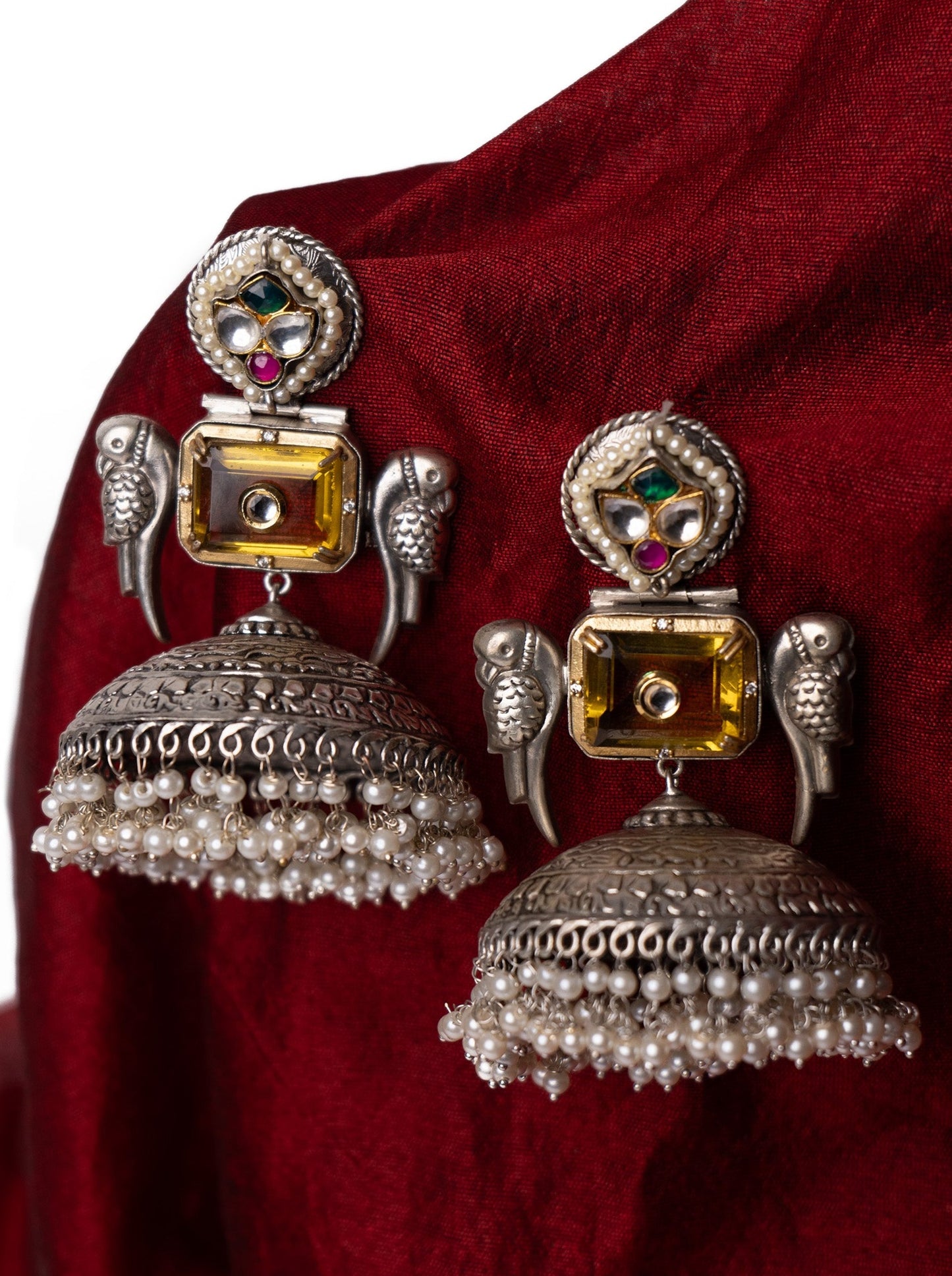 Statement jhumkis with yellow stone